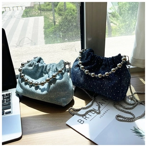 Blue denim drawstring bucket bags with pearl bead handles and chain straps