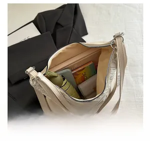 Top view of the spacious interior of a beige woven tote bag showing large capacity