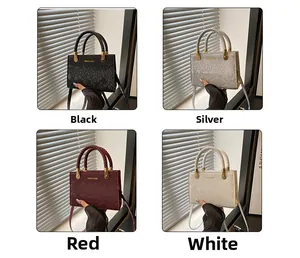 Detail of four stone patterned mini square bags in black, silver, red and white finishes