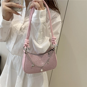 Pink sequin underarm bag with silver chain, pearl heart charms and knotted strap style