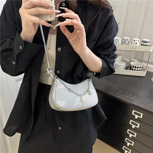 Silver glitter crescent shoulder bag with pearl chain detail and metallic strap for women