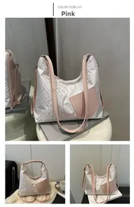 Detailed close-up of pink jacquard tote bag featuring geometric patterns and leather patch