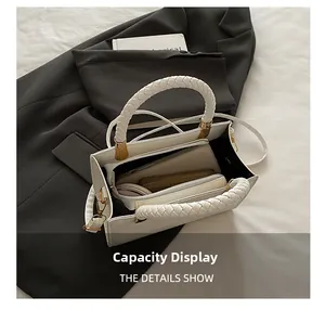 Internal view of white tote bag showing storage capacity for phone and wallet