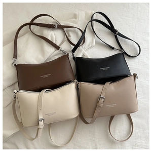 Top view of bucket bags in brown, black, cream, and beige colors with silver hardware