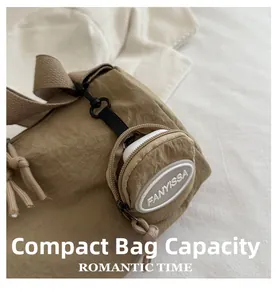 Detail of khaki nylon pleated bag with a round detachable pouch holding wireless earbuds