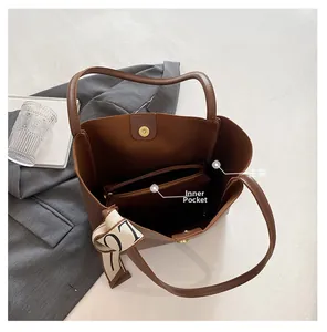 Internal view showing the spacious main compartment and zippered divider of the tote bag