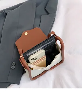 Internal view of crossbody bag showing spacious storage for smartphone and wallet
