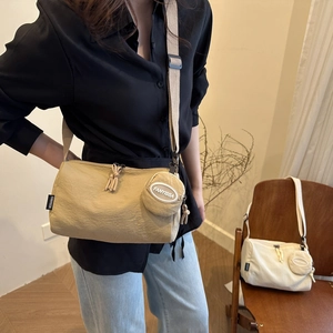 Minimalist nylon crossbody barrel bag with small round pouch in khaki for women