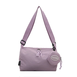Minimalist lavender nylon crossbody bag with matching round coin purse and woven zippers