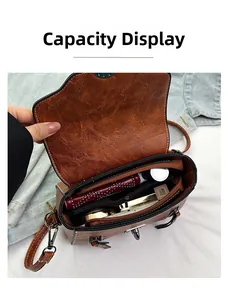 Top view of open retro brown crossbody bag showing internal compartments and storage