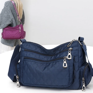 Quilted nylon crossbody bag with multi-zipper pockets and adjustable strap for women
