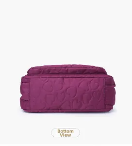 Detailed bottom view of large purple nylon bag with elegant heart-shaped quilted stitching