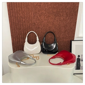 Collection of minimalist crescent hobo bags in glossy patent leather finish and chain straps