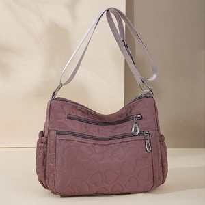 Quilted heart nylon shoulder bag with multi-pocket design and adjustable strap