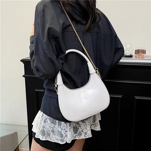 Chic white patent leather crescent bag with gold chain strap and high-gloss finish