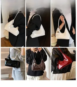 Detailed views of minimalist faux leather baguette bags with silver heart charm decoration