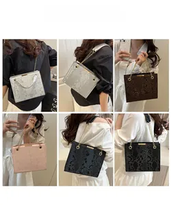 Chic snakeskin embossed tote bag shown in four colors with gold chain straps on models