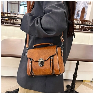 Retro brown oil-wax leather crossbody bag with vintage metal clasp and top handle for women