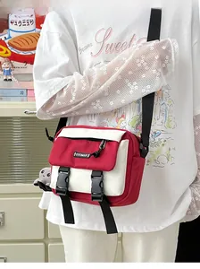 Detail view of red and white crossbody bag with octopus plush toy and plastic buckles