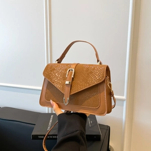 Fashionable brown snake pattern crossbody bag with metal lock and top handle