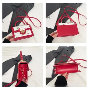 Four-angle detail view of red cherry print handbag featuring gold flower lock and woven handle
