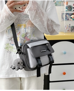 Detail view of Japanese style patchwork crossbody bag with octopus plush charm