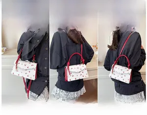 Three-way display of white cherry print crossbody bag showing hand-carry and shoulder styles