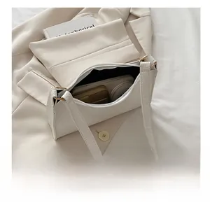 Internal view of white crocodile pattern underarm bag showing spacious storage capacity