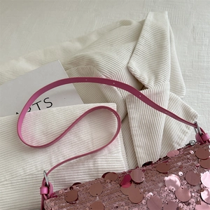 Chic pink sequin shoulder bag for women with adjustable strap on white background