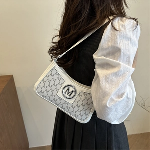 French vintage underarm bag with letter M pattern and silver metallic logo detail