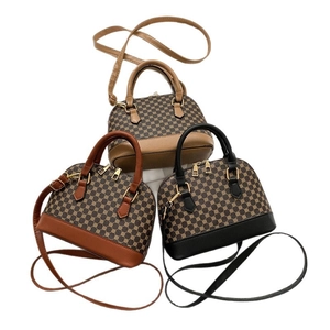 Three-color set of vintage shell bags with round monogram patterns and golden hardware