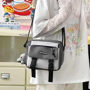 Japanese style canvas messenger bag in grey and beige with adjustable strap and elephant charm
