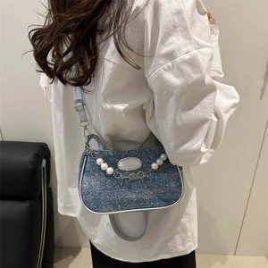 Blue denim half-moon shoulder bag with pearl floral chain and fashion logo label