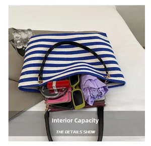 Detail view of large striped tote bag interior capacity with everyday essentials