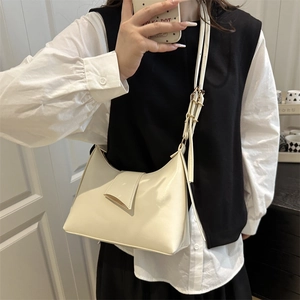 Chic beige crossbody bag in glossy faux leather with gold buckle for women