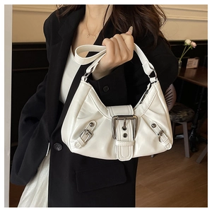 Detail of white PU leather hobo bag with large metal buckle and vintage motor style