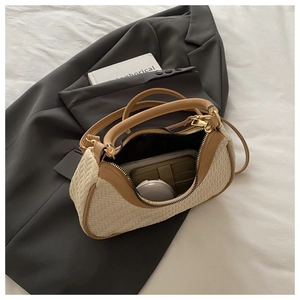 Detail of woven beige handbag interior with olive card holder and premium leather trim