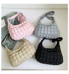Quilted cloud shoulder bag detail showing pink, grey, beige and black color options