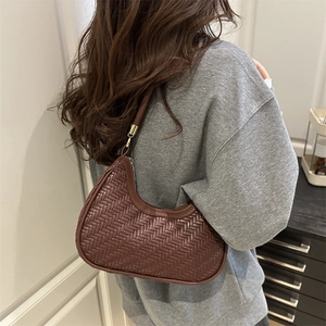 Brown woven hobo bag for women with a stylish crescent shape and adjustable strap