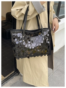 Detail shot of the Creative Cat sequin tote bag with shimmering scales on black material