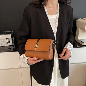 Brown lychee leather shoulder bag with gold clasp and contrast trim in a square design