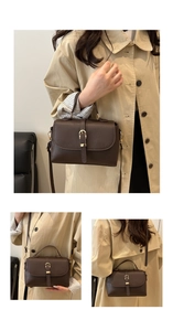 Detail of dark brown lychee textured leather handbag with gold buckle and adjustable strap