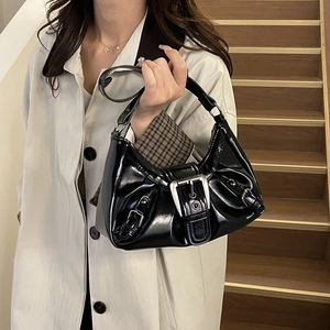 Vintage Y2K black patent leather shoulder bag with bold silver buckles and pleated design