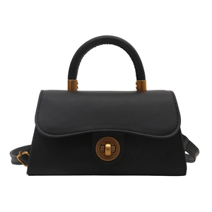 Schwarze Leder-Handtasche im Retro-Stil mit goldenem Drehverschluss und Schultergurt