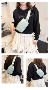 Detail of light green nylon crossbody bag with adjustable strap and durable buckle