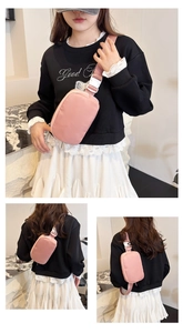 Detail of pink oxford crossbody bag with adjustable wide strap and quick-release buckle