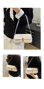 Close-up of white crocodile pattern baguette bag with an elegant golden oval metal buckle