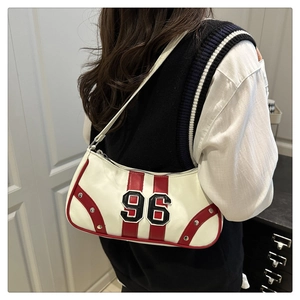 Close-up of white Y2K underarm bag featuring red racing stripes and 96 patch detail