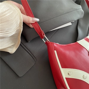 Chic red and white underarm bag with silver studs and premium leather texture