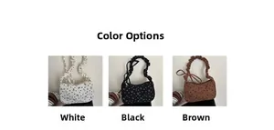 Detailed display of pleated shoulder bags in white, black and brown with floral patterns